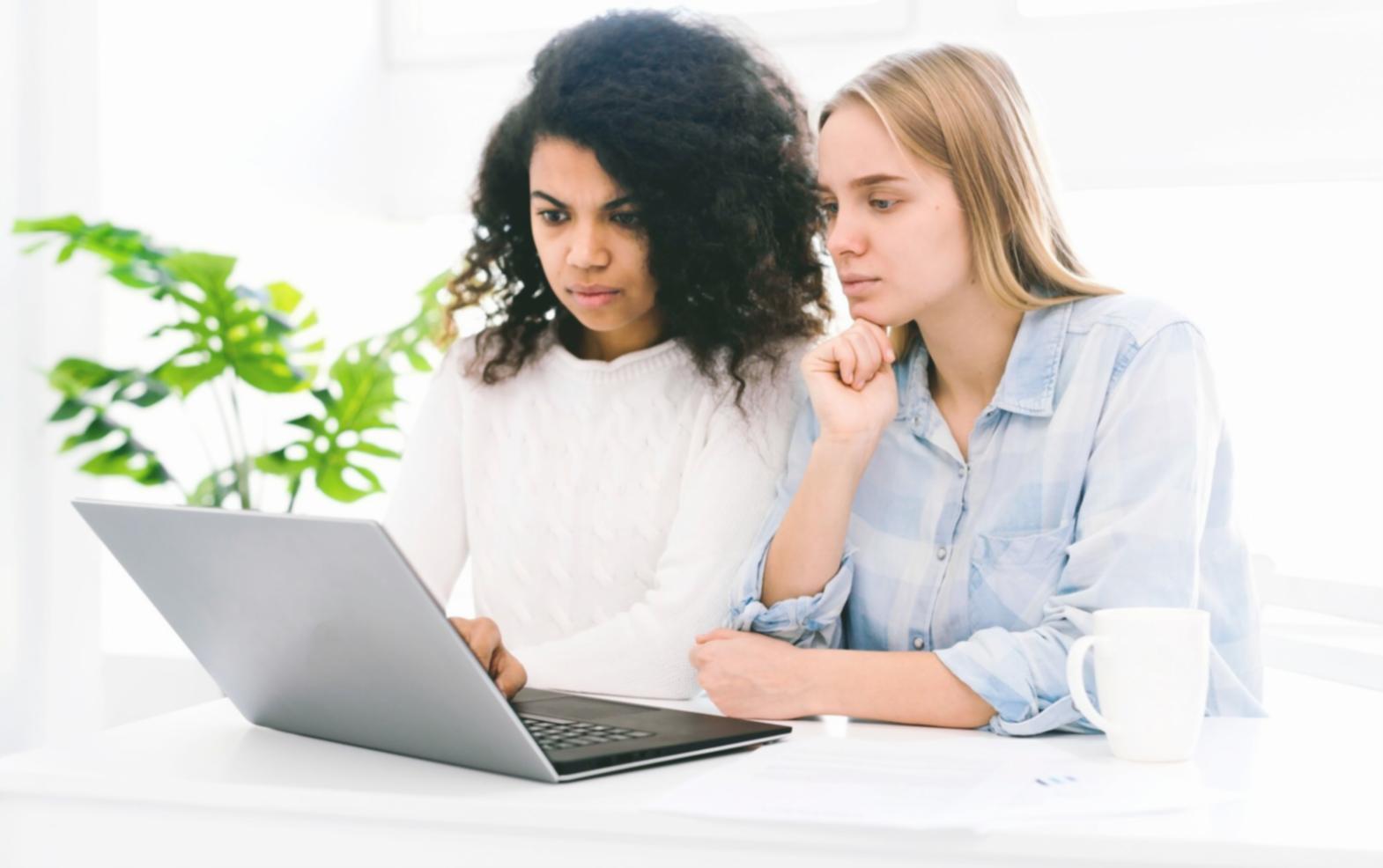 Family reviewing budget worksheets together at kitchen table